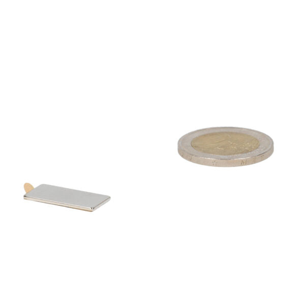 Silver neodymium block magnet 20x10x1 with self-adhesive back, suitable for various applications