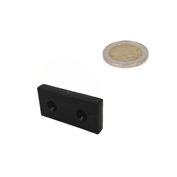 Black rectangular neodymium block magnet with plastic coating and two countersunk holes visible on the back