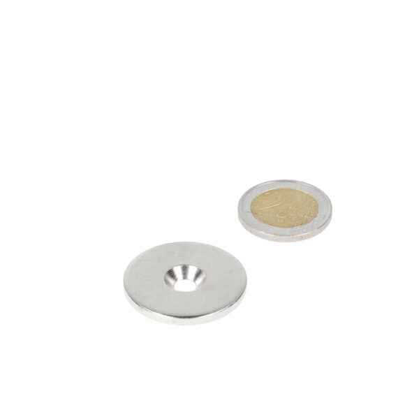 Silver grey steel ring with drill countersunk hole and concentric ridges provides precision and sturdiness