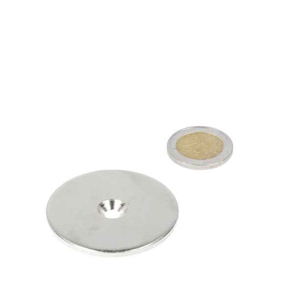Silver ring made of steel with drill countersunk hole 48 x 11 x 5.5 x 3 mm next to coin for various applications