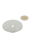 Silver steel ring 60 x 3 x 5.5 x 11 mm with drill- countersunk hole next to coin for scale, steel -let