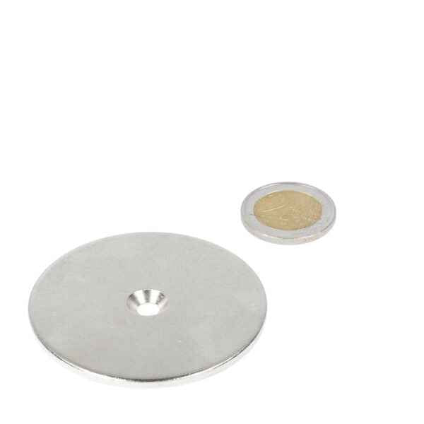 Silver steel ring 60 x 3 x 5.5 x 11 mm with drill- countersunk hole next to coin for scale, steel -let
