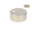 A neodymium magnet disc of 60 x 25 mm with countersunk hole and a polished metal finish for various applications