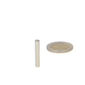 Silver-coloured high-grade neodymium magnet rod magnet 4 x 25 mm next to coin for scale comparison
